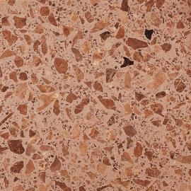 Un primer plano de un suelo de terrazo con muchas piedras pequeñas sobre él.