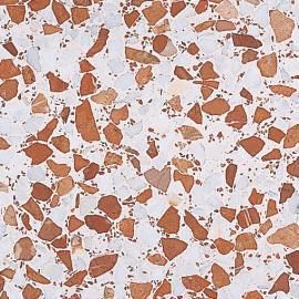 Un primer plano de un suelo de terrazo con rocas marrones y blancas.
