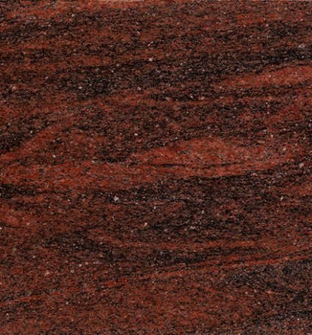 Un primer plano de una encimera de granito rojo.