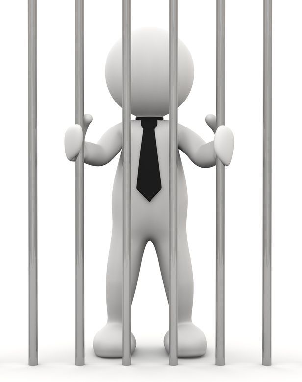 Person hinter Gittern
