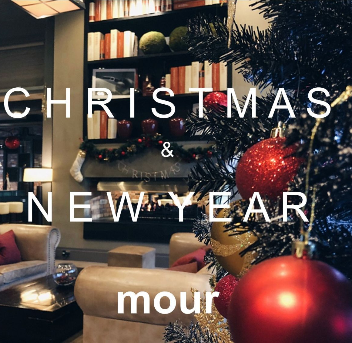 Christmas and New Year decor in a cozy interior setting with a Christmas tree and a sofa.