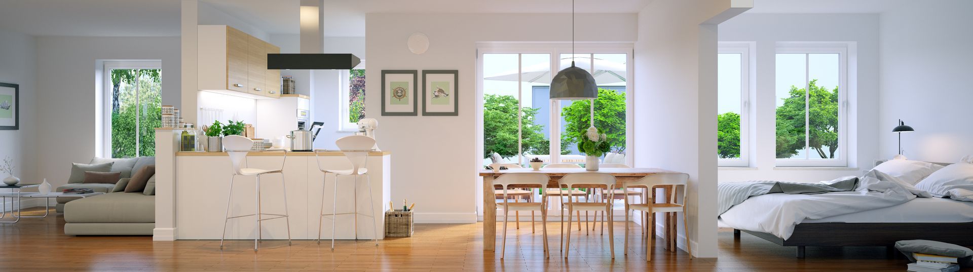 Appartement spacieux et lumineux avec cuisine ouverte, coin repas et chambre, le tout avec de grandes fenêtres et du parquet.