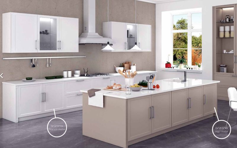 Una cocina con gabinetes blancos y una gran isla en el medio.