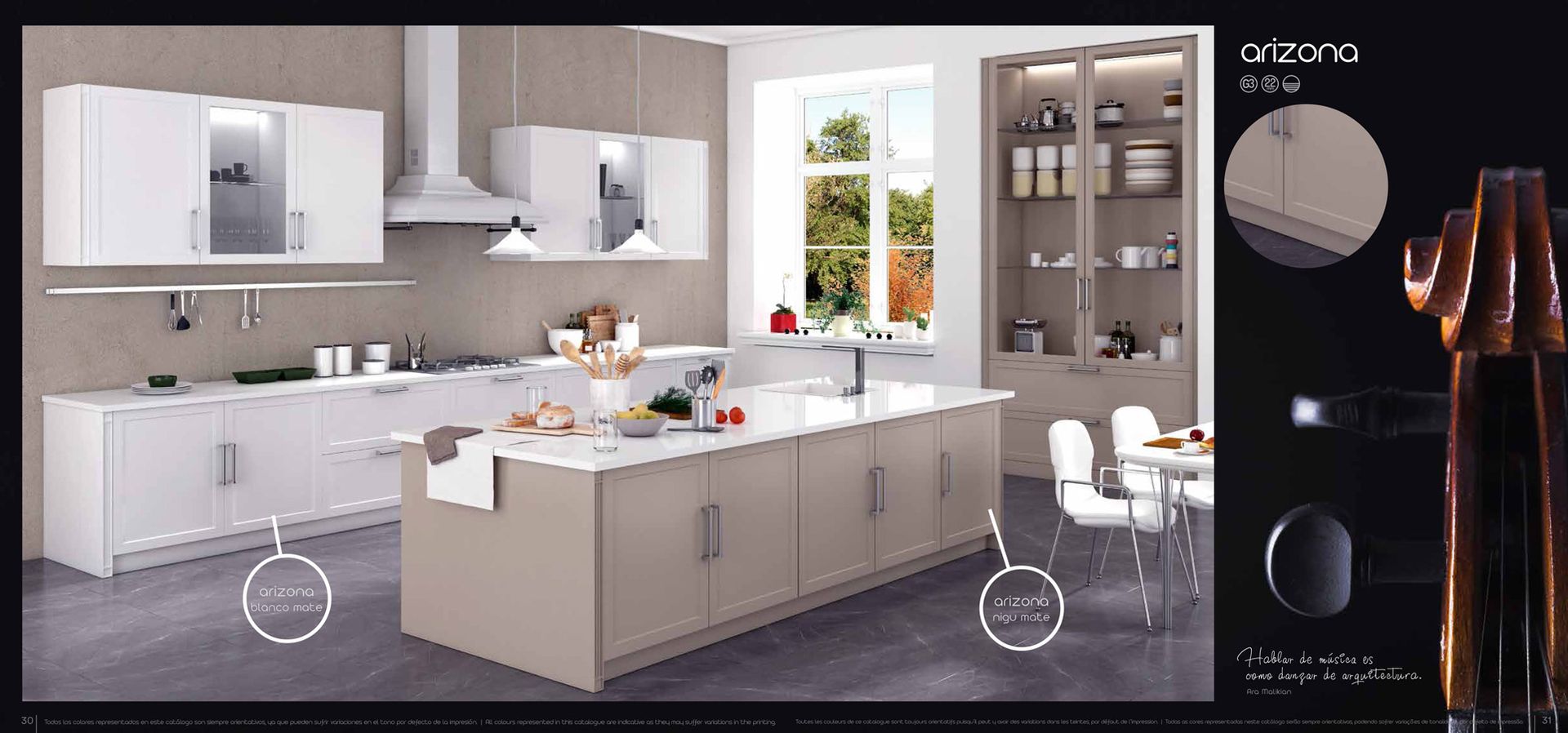 Una cocina con gabinetes blancos y una gran isla en el medio.