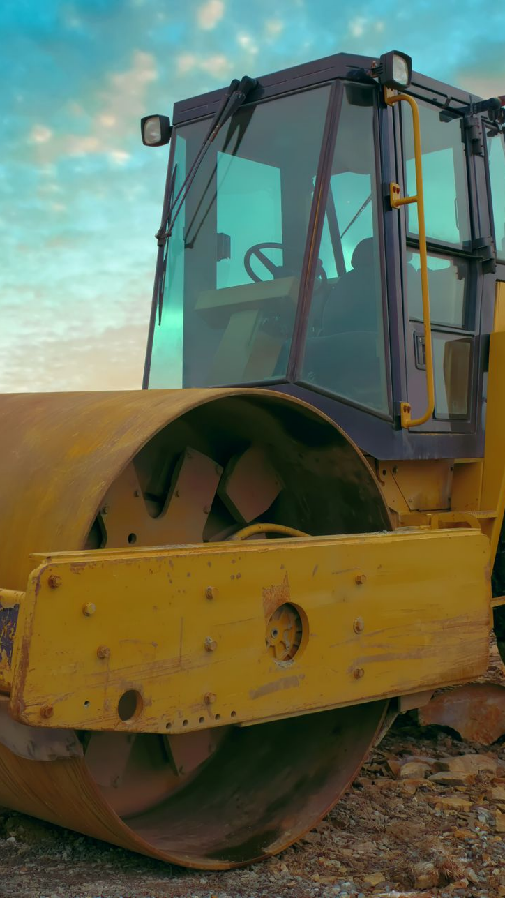 Rouleau compresseur jaune à cabine vitrée transparente 