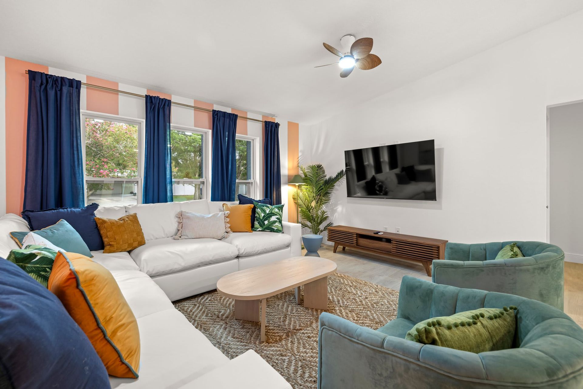 Vibrant Airbnb living room with bold accents and natural light.