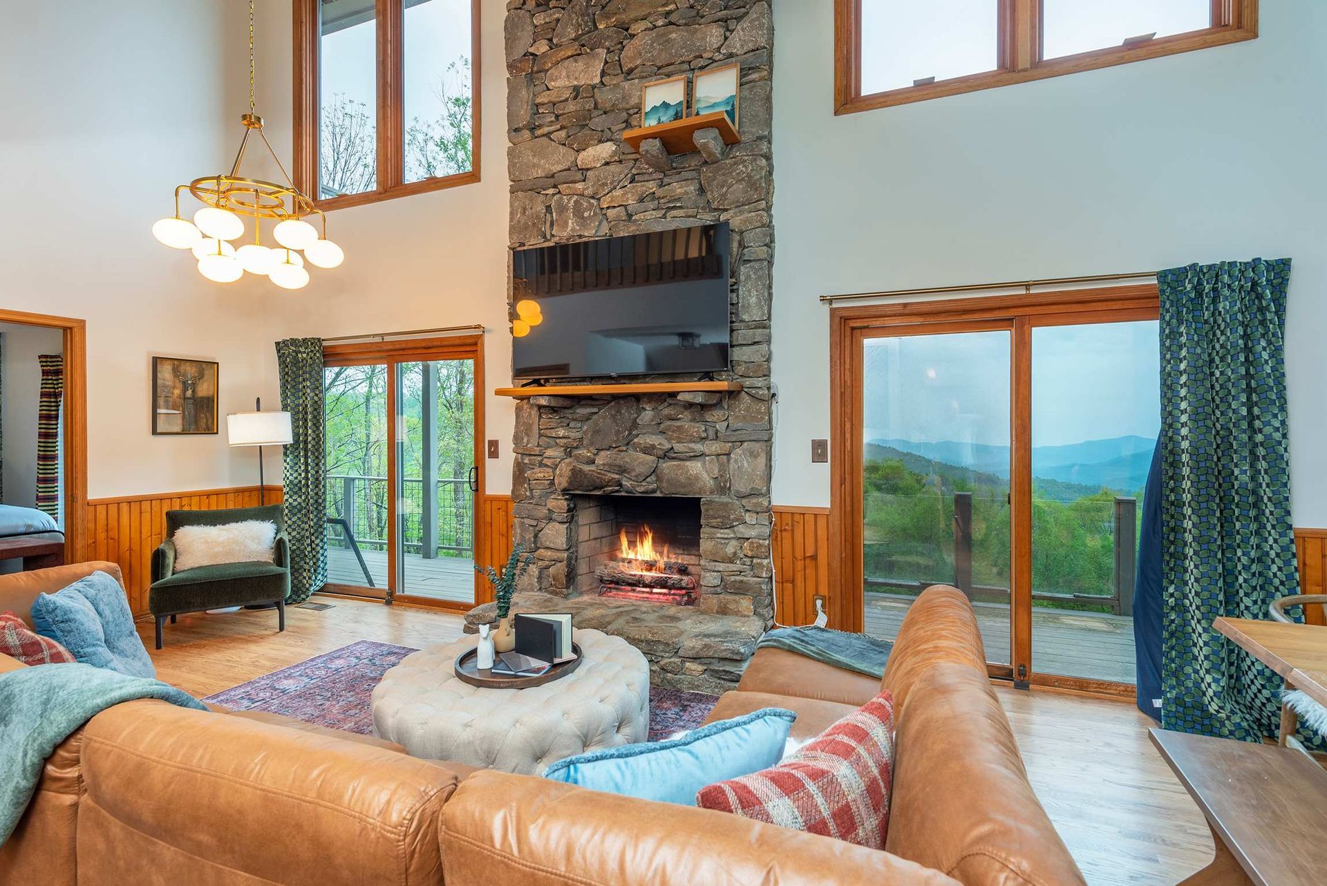 Airbnb living room with modern layout, warm tones, and natural light.