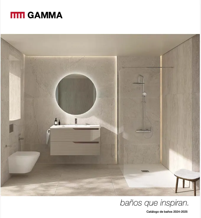 Un baño con un espejo redondo y un inodoro.