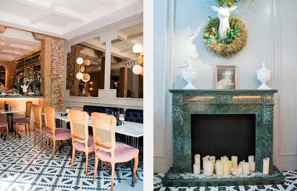 Un restaurante con mesas y sillas y una chimenea con velas.