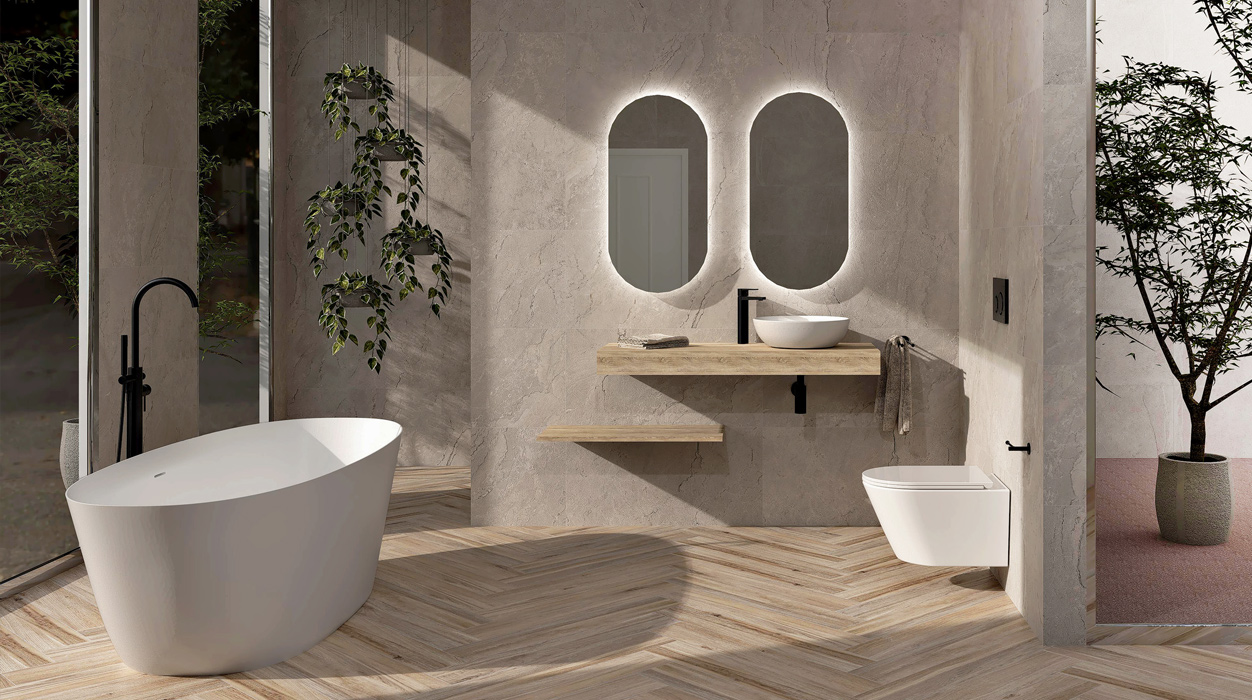 Un baño con bañera, lavabo, inodoro y espejos.