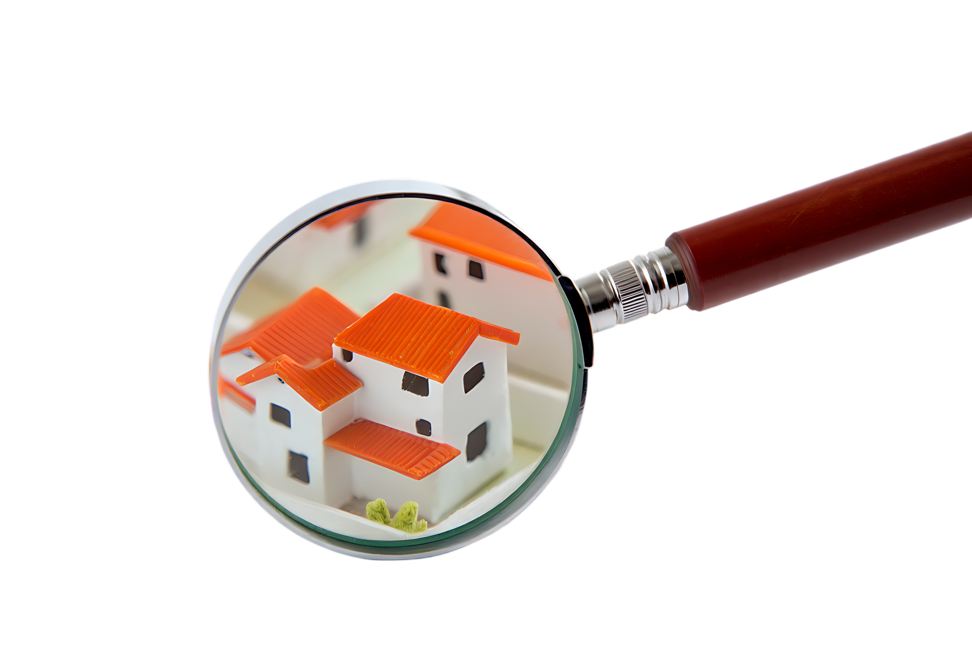 La loupe  sur des maisons blanches miniatures aux toits orange.