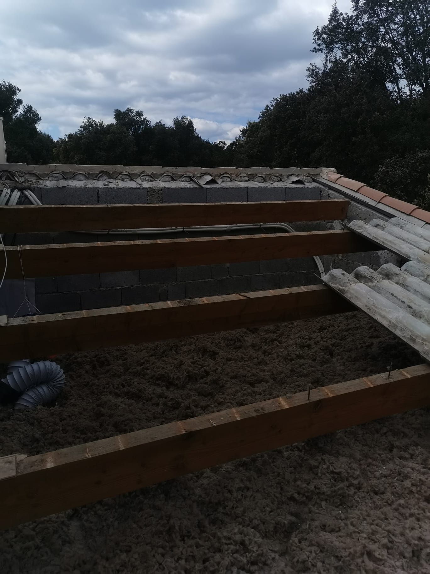 Combles visibles avec laine soufflée