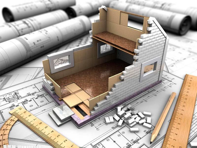 Un modelo 3D de una casa está sobre planos.