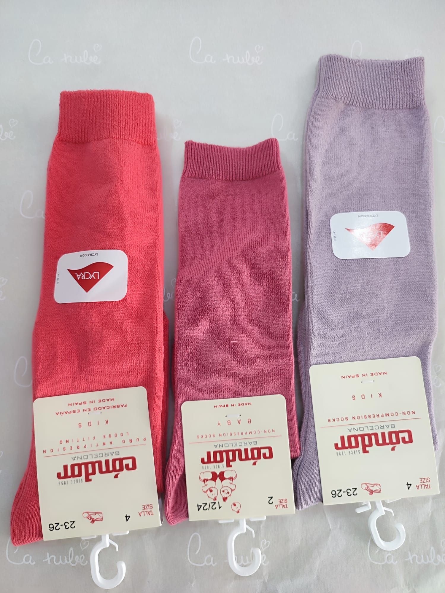 Tres pares de calcetines de cóndor rosados ​​y morados