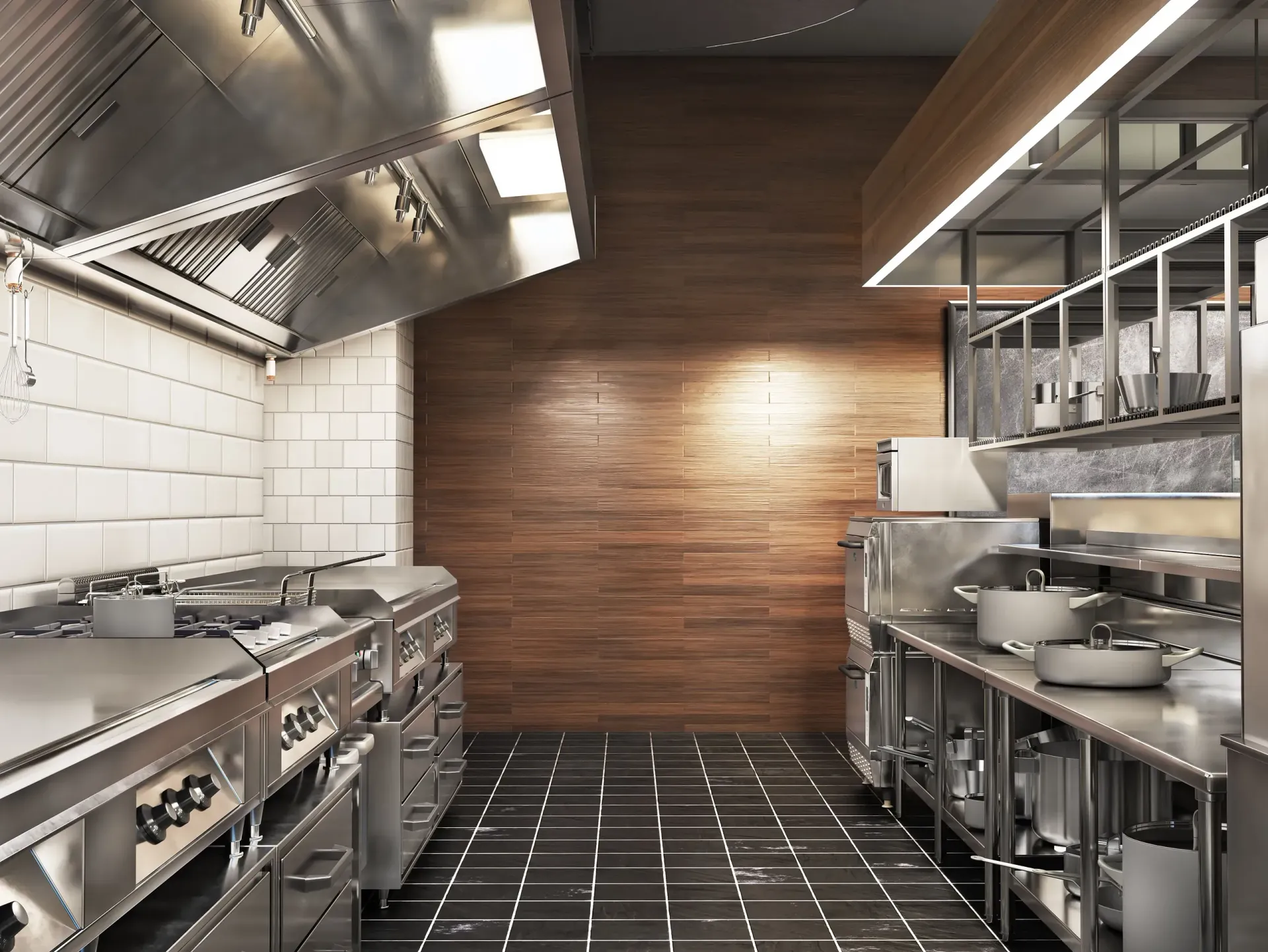 Una cocina con electrodomésticos de acero inoxidable y una pared de madera.