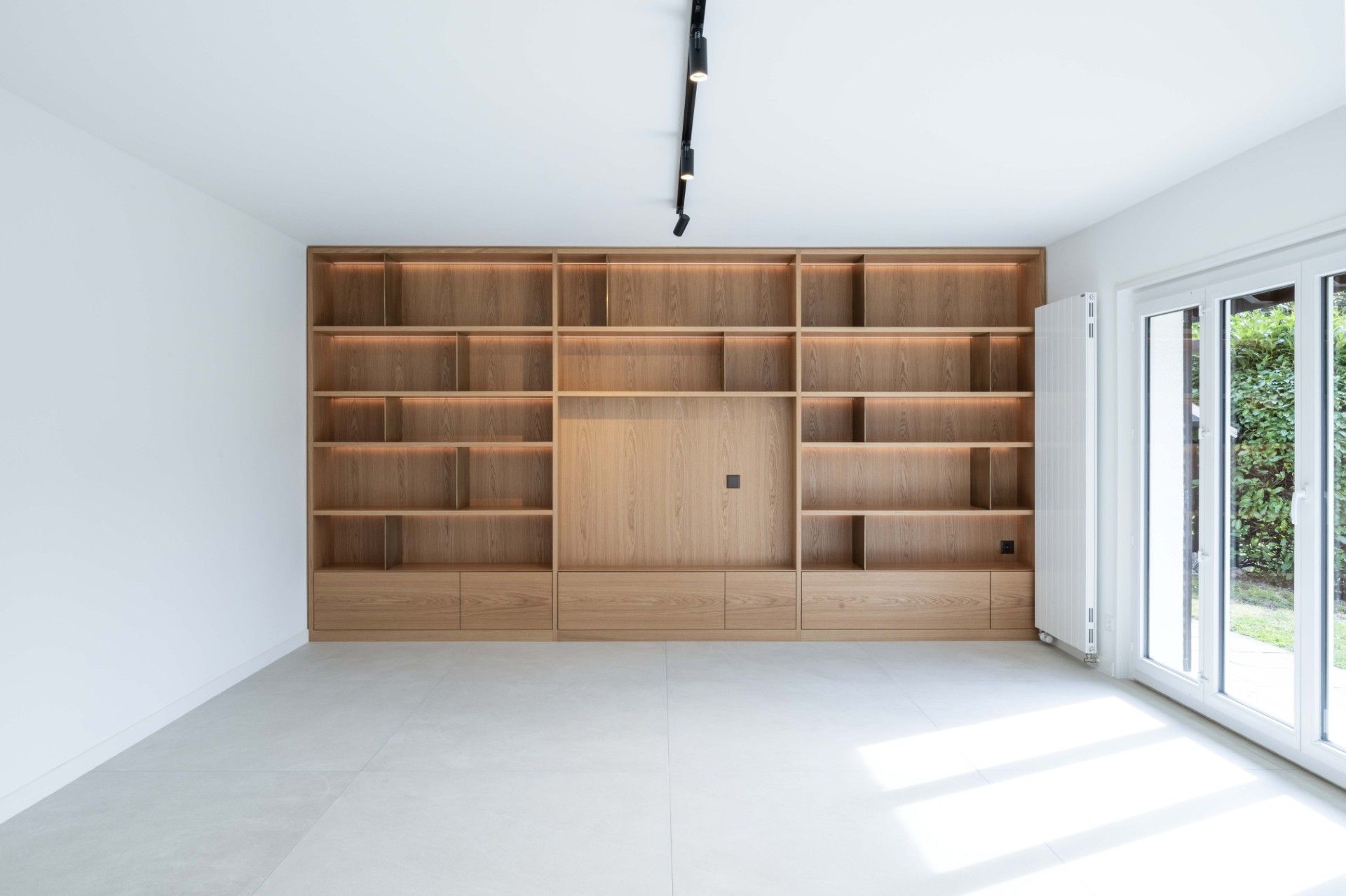 ROSSI EBENISTERIE SA concept by archinéa sàrl Bibliothèque - Séjour