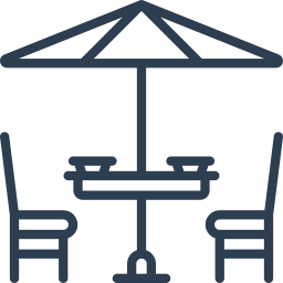 Un dibujo lineal de una mesa y sillas bajo una sombrilla.
