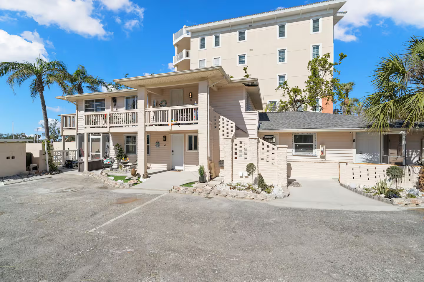 A large building with a parking lot in front of it