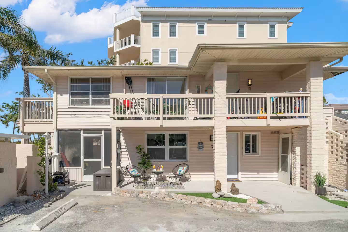 A large house with a lot of windows and balconies is for sale.