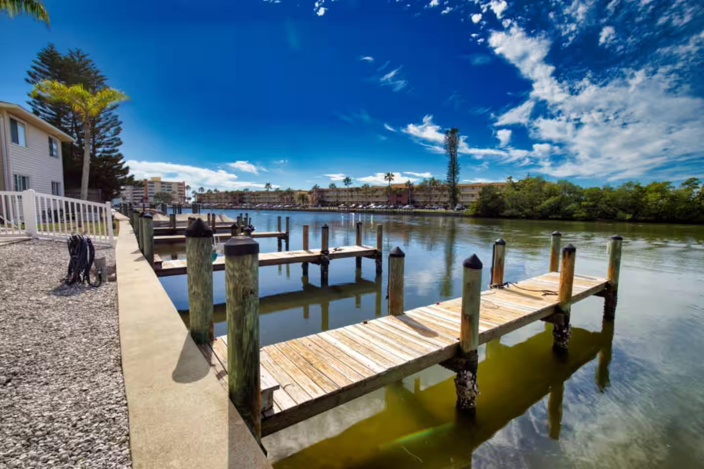 A large body of water with a dock in the middle of it