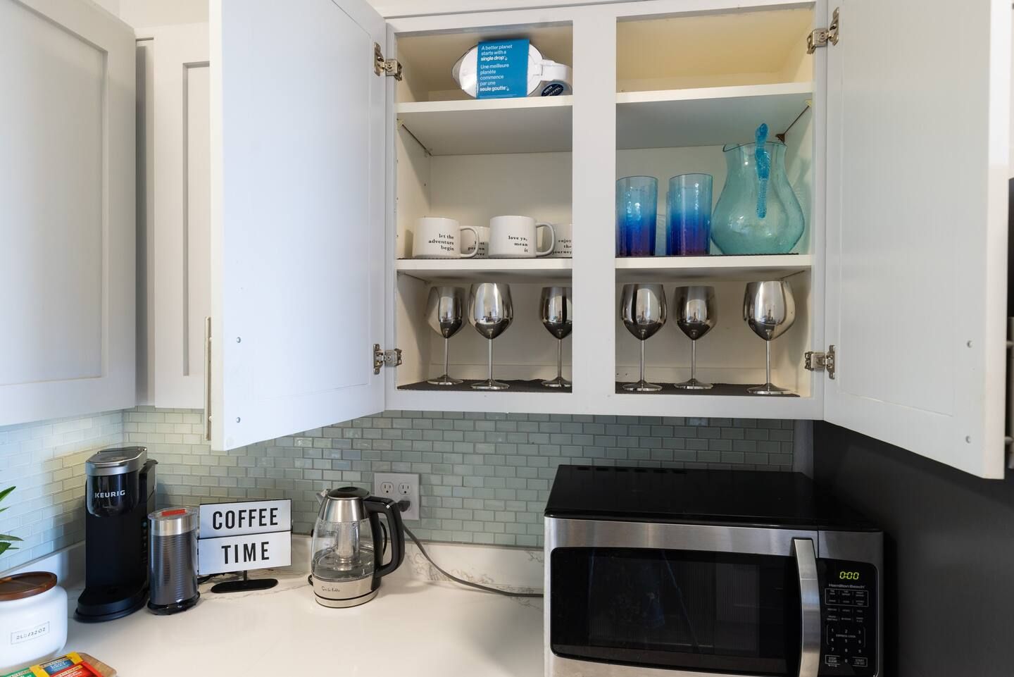 A kitchen with a sign that says coffee time on it