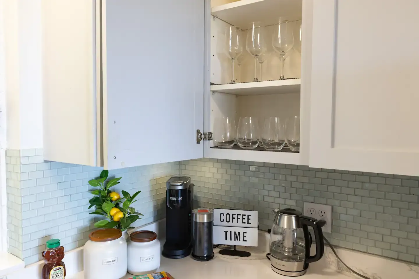 A kitchen with a sign that says `` coffee time '' on it.