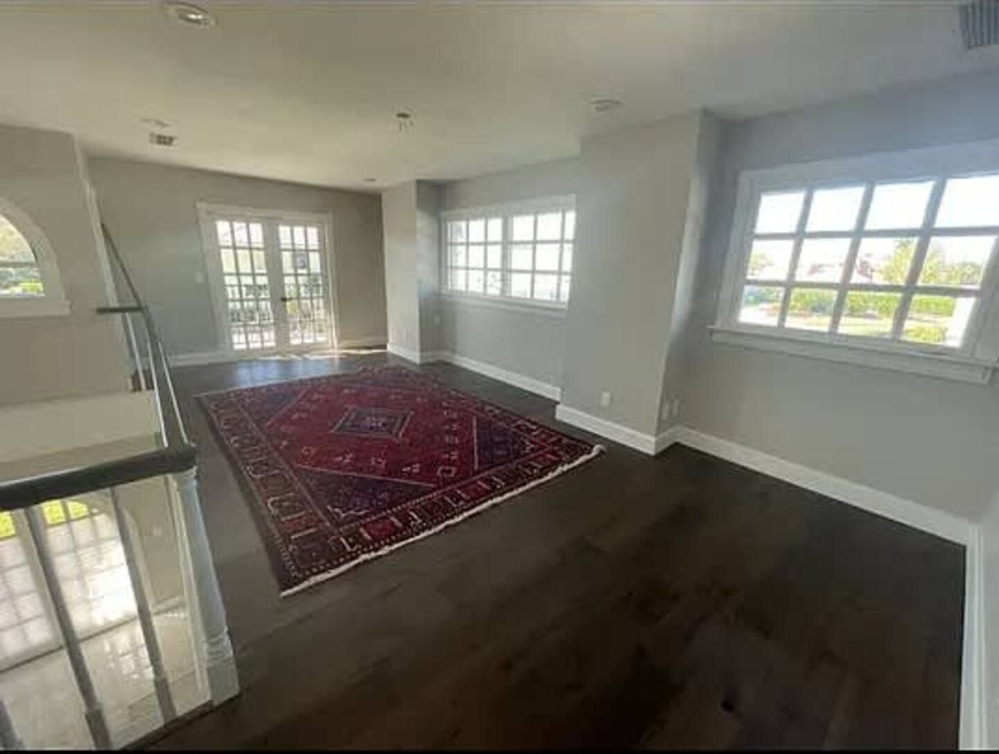 There is a rug in the middle of the room.