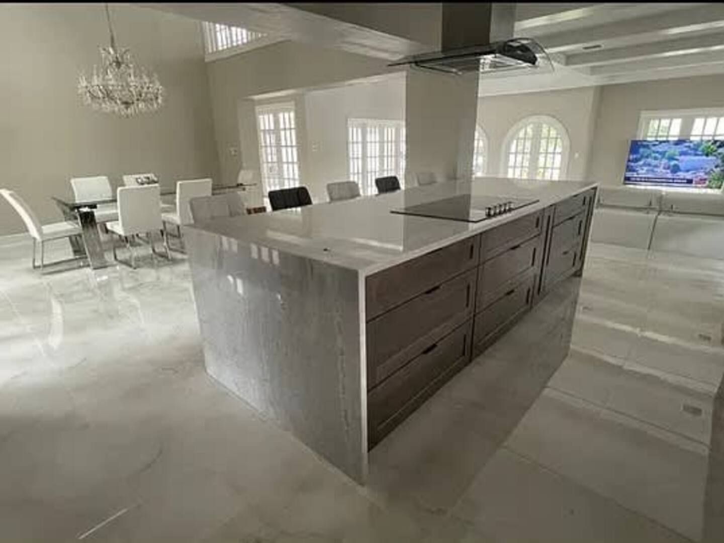 A kitchen with a large island in the middle of the room.