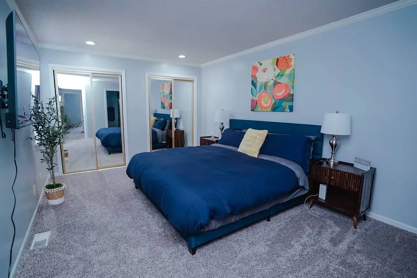 There is a large bed in the middle of the room.