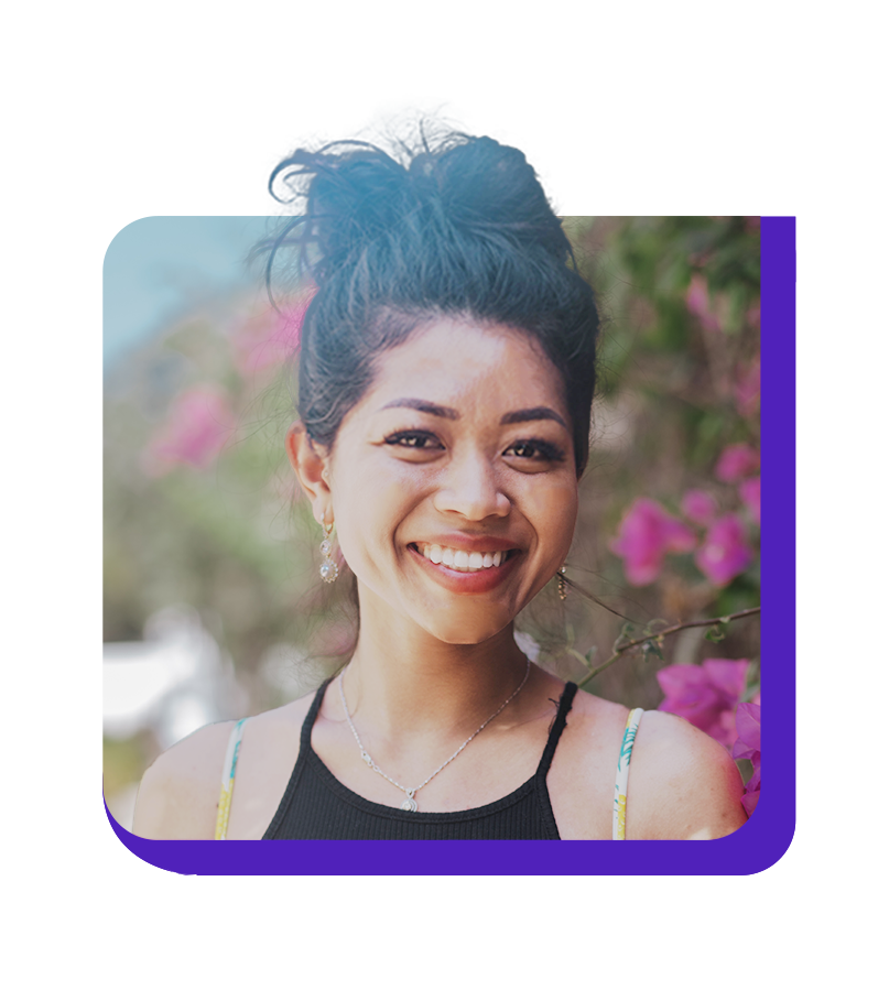 Andrew Bui is in a grey suit outside.