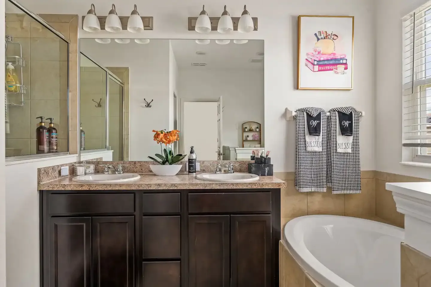 Two sinks vanity with a luxurious bathtub.