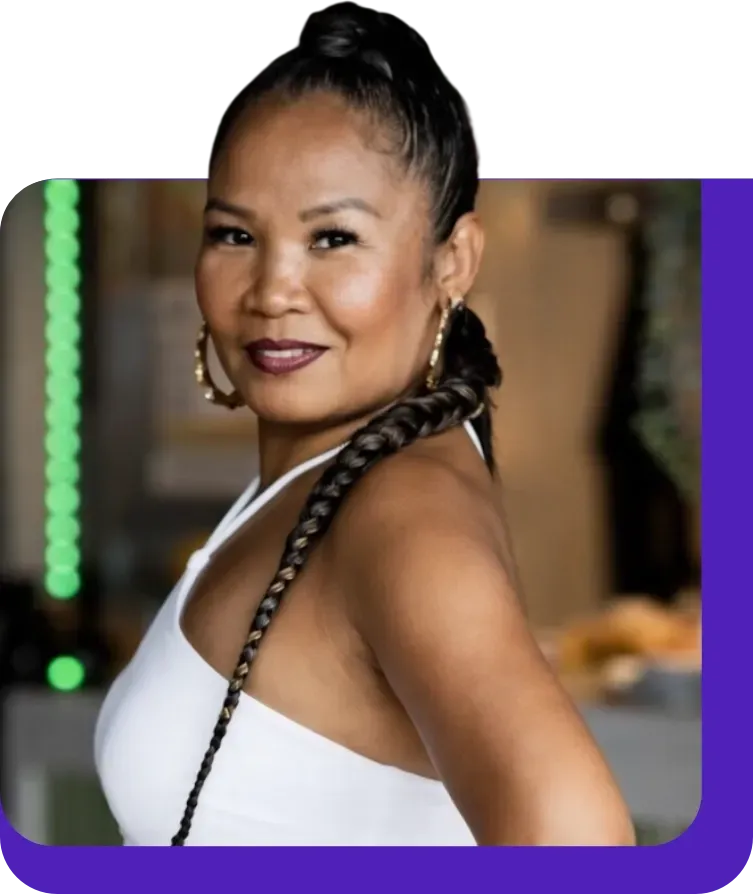 Andrew Bui is in a grey suit outside.