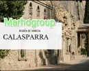 Una imagen de un edificio de piedra con las palabras marhogroup en él.