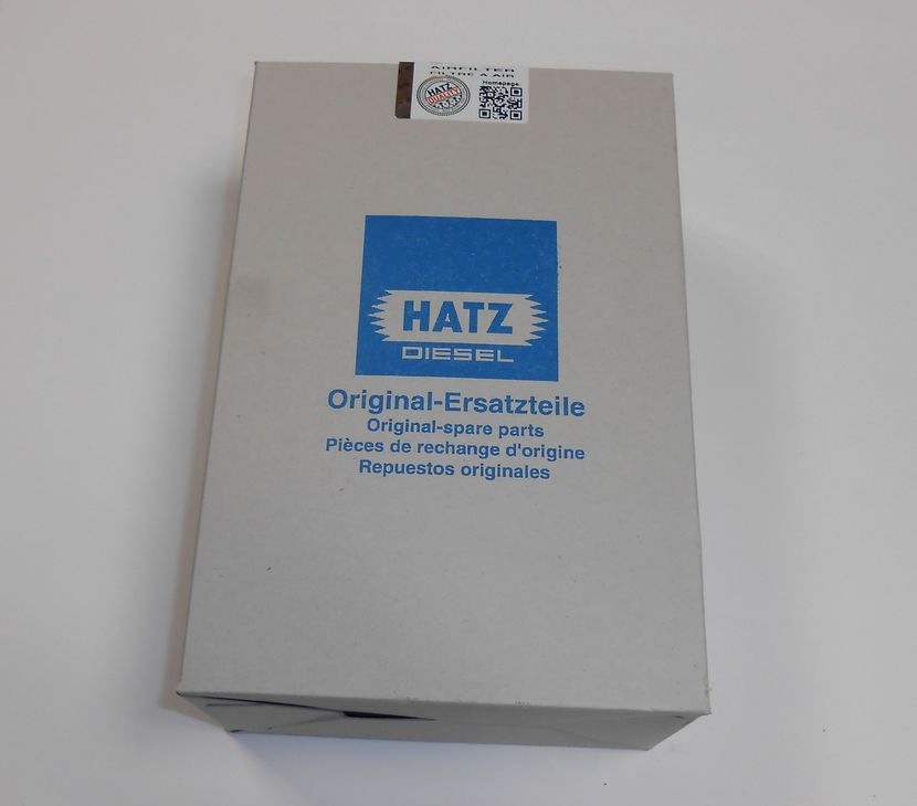 Boîte avec le logo bleu Hatz Diesel et l'inscription « Pièces de rechange d'origine ».
