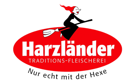Logo for Harzländer Traditions-Fleischerei: Red oval with white text, witch on broom. Text: