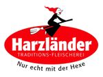 Logo: Witch on broom above 