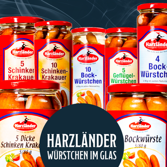 Assorted Harzländer Wurstwaren jars with red lids and labels on a dark background