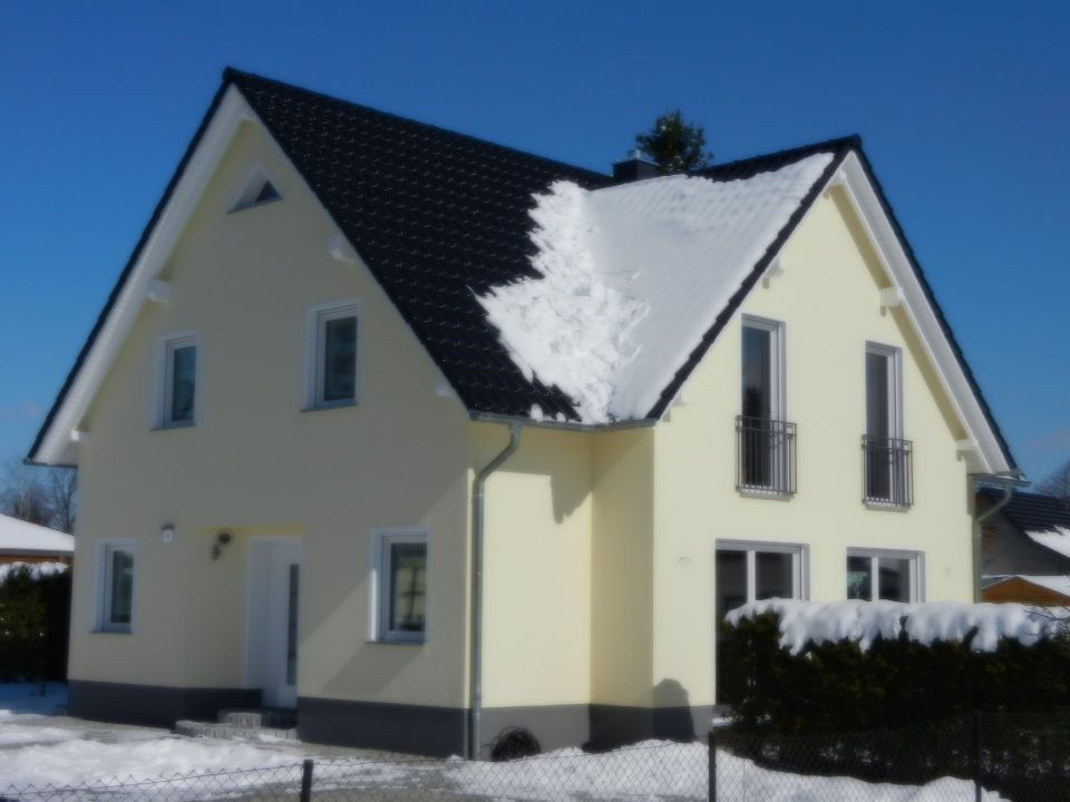 Einfamilienhäuser in verschiedenen Stilrichtungen