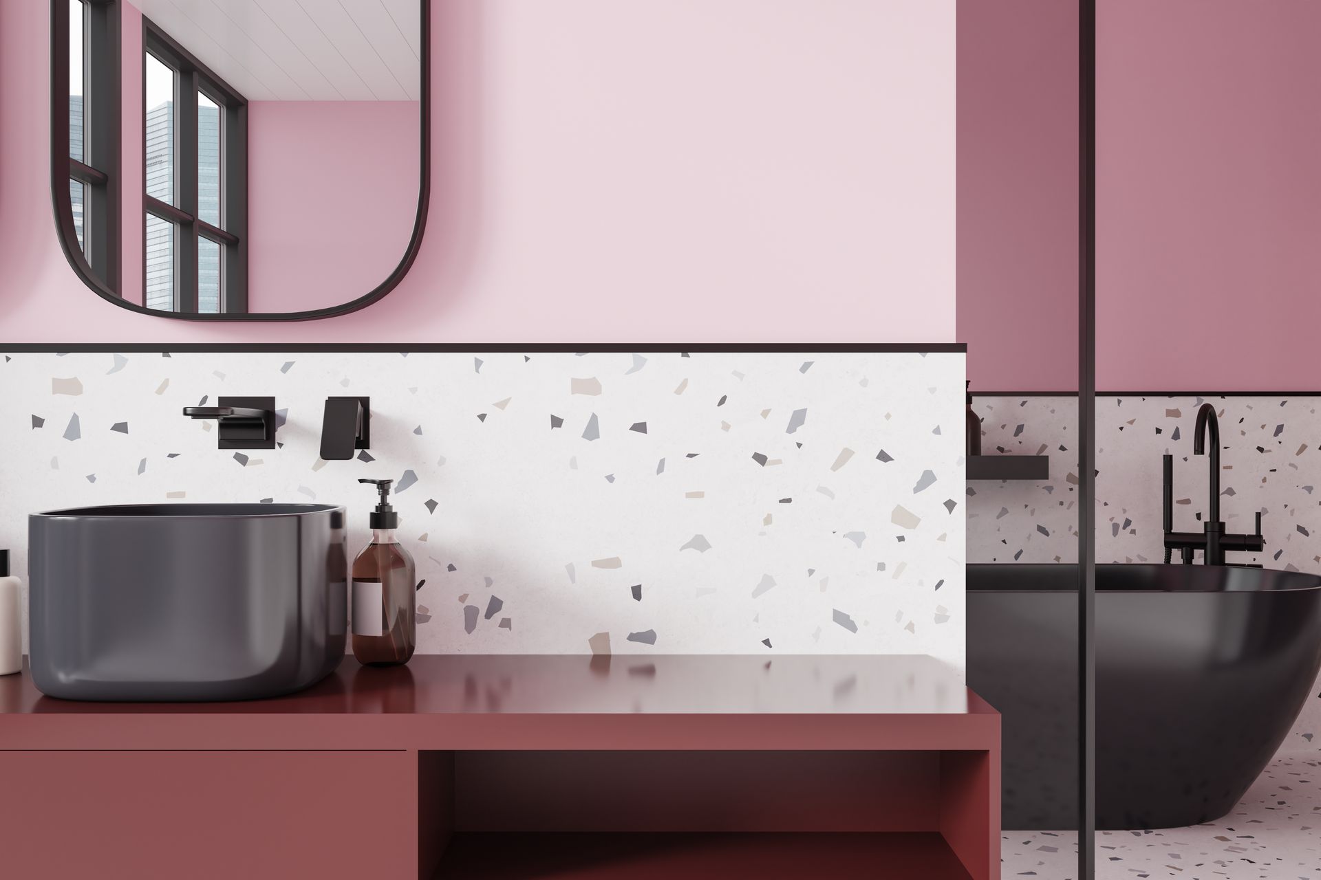 Meuble lavabo rose avec lavabo, miroir et robinetterie noire.