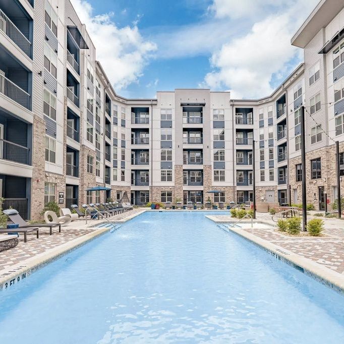 A large swimming pool in the middle of a building
