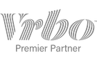 Vrbo Premier Partner logo in gray with stylized striped lettering on a white background