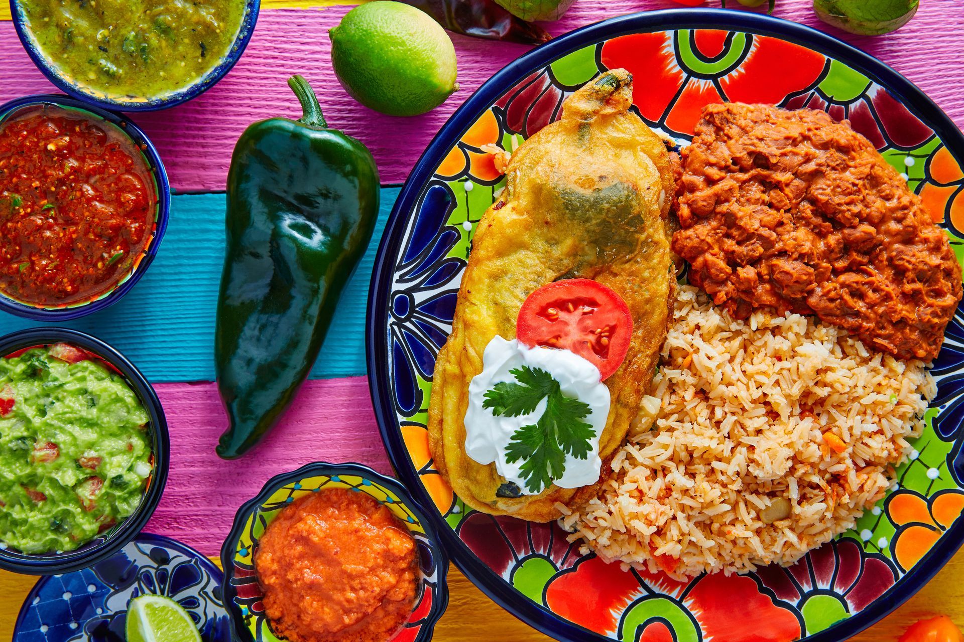 Mexican dish with chile relleno and sides