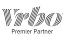 Vrbo Premier Partner logo in gray with stylized striped lettering on a white background