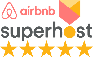 Airbnb Superhost badge with logo, large “superhost” text, and five gold stars