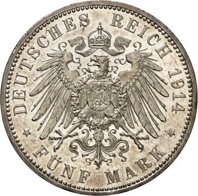Eine Nahaufnahme einer Silbermünze mit einem Adler darauf.