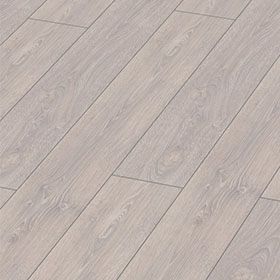 Un primer plano de un piso de madera blanco con un patrón diagonal.