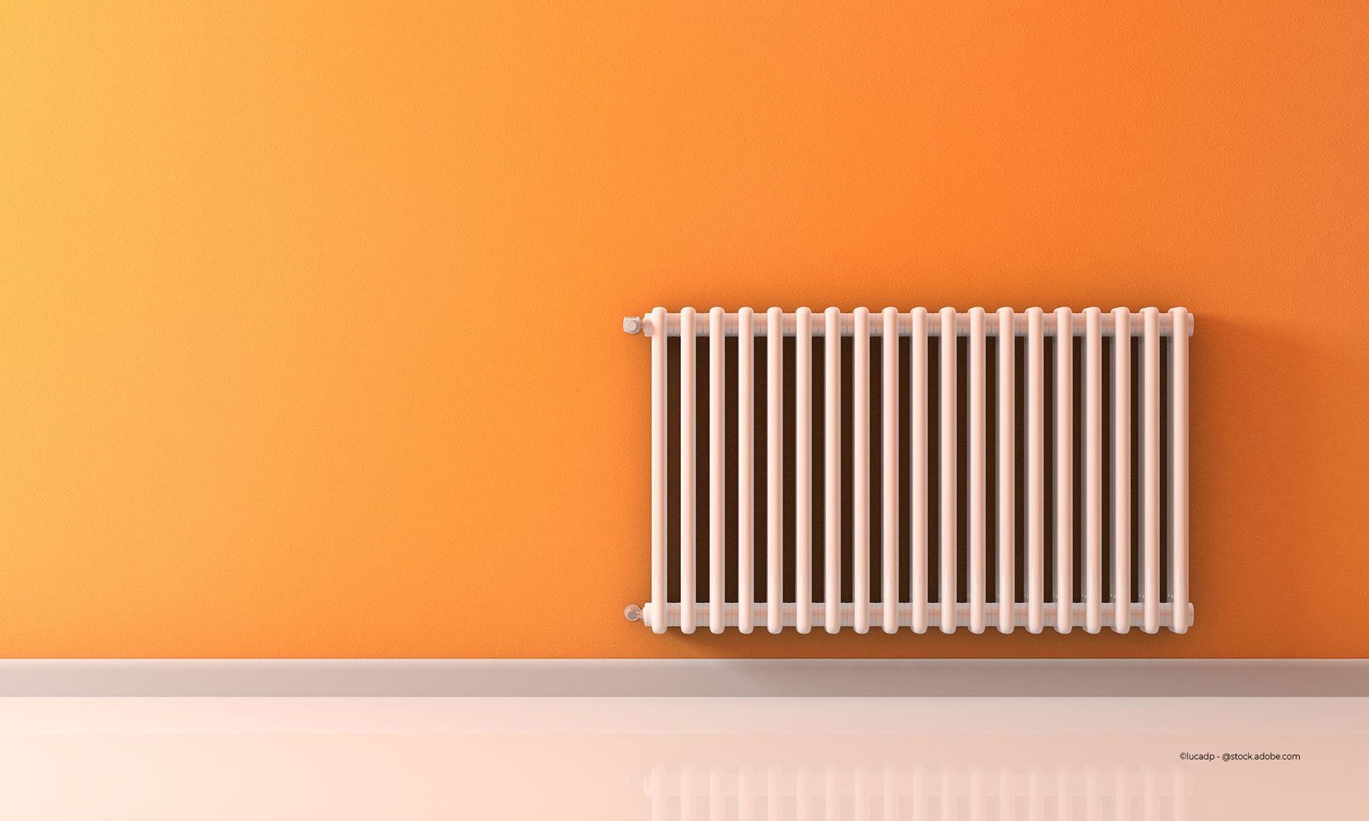 Von Siebert Andre Heizung- und Sanitärmeisterbetrieb installierte Heizung an einer orangefarbenen Wand