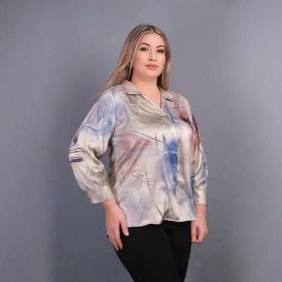 A woman is standing on a set of stairs holding a jacket.
