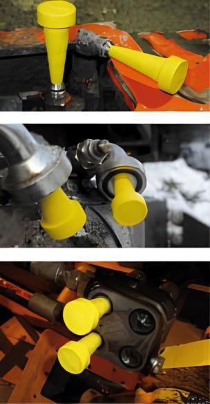 Capuchons de protection jaunes recouvrant les accessoires de machines.