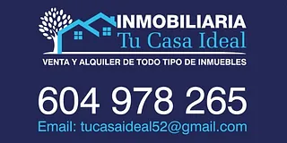 Un cartel azul que dice inmobiliaria tu casa ideal